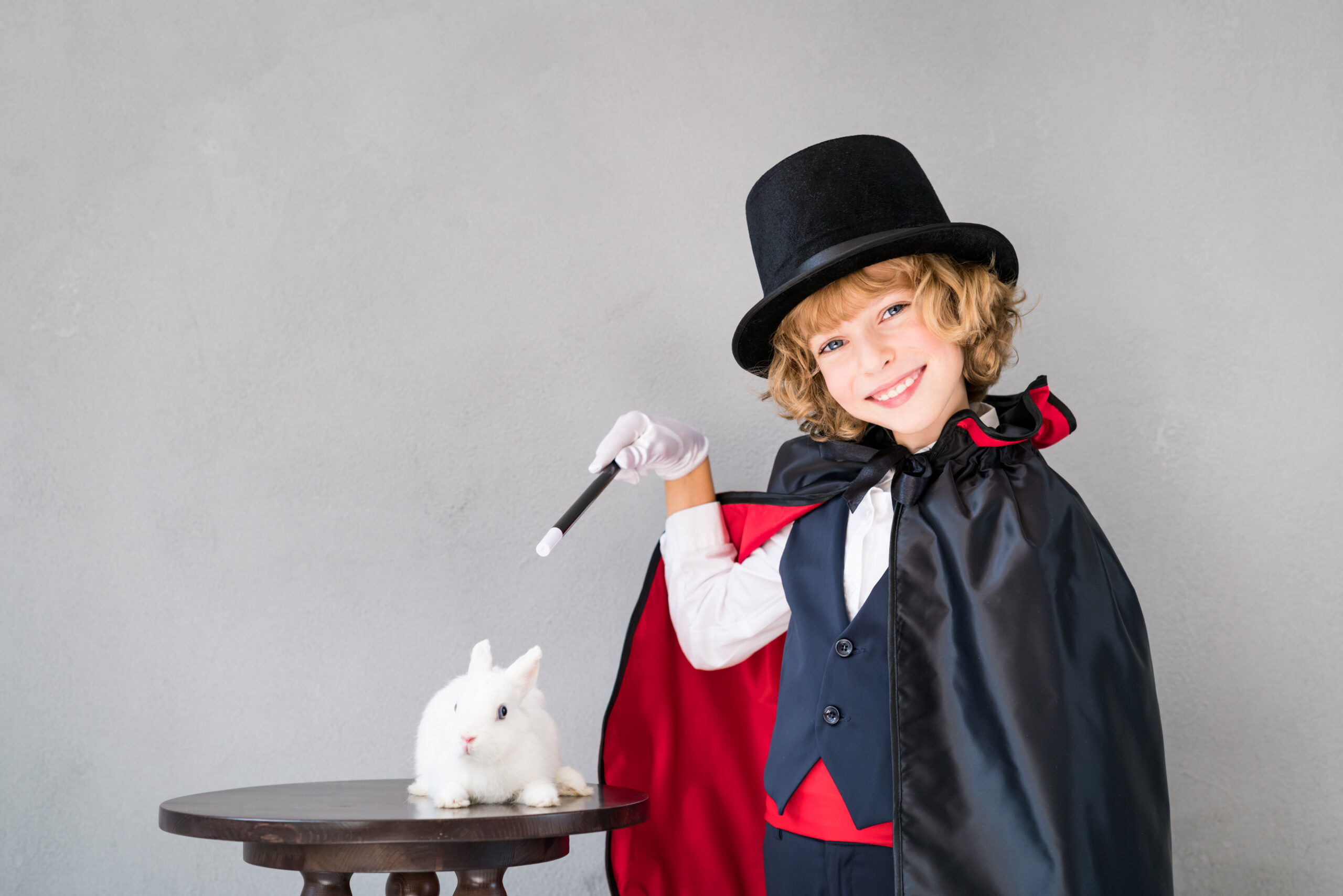 Child,Magician,With,Cute,Rabbit.,Happy,Kid,Playing,At,Home.